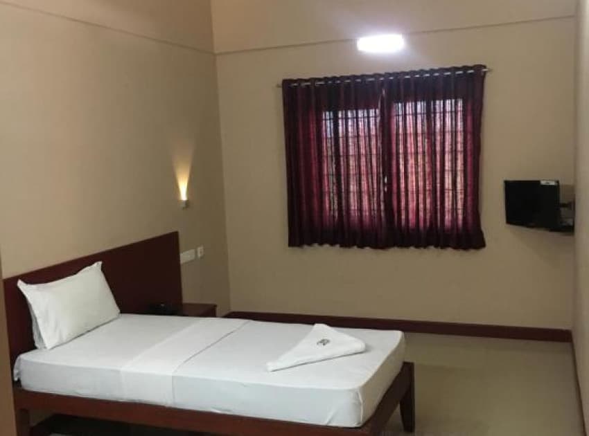 Book Economy Single Room room in Kasaragod
