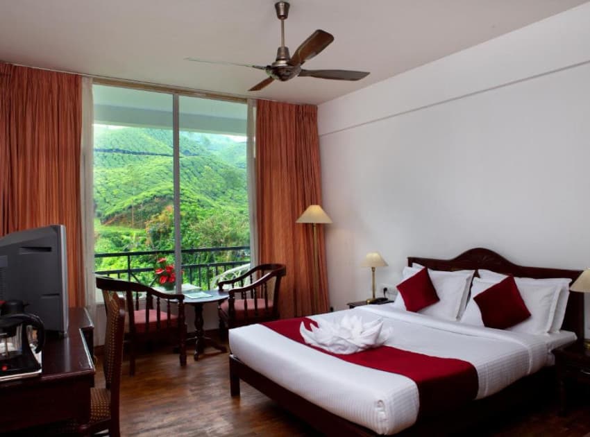 Book Double Room with Balcony room in Munnar