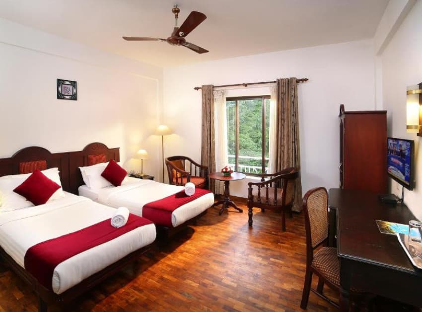 Book Double Room with Balcony room in Munnar